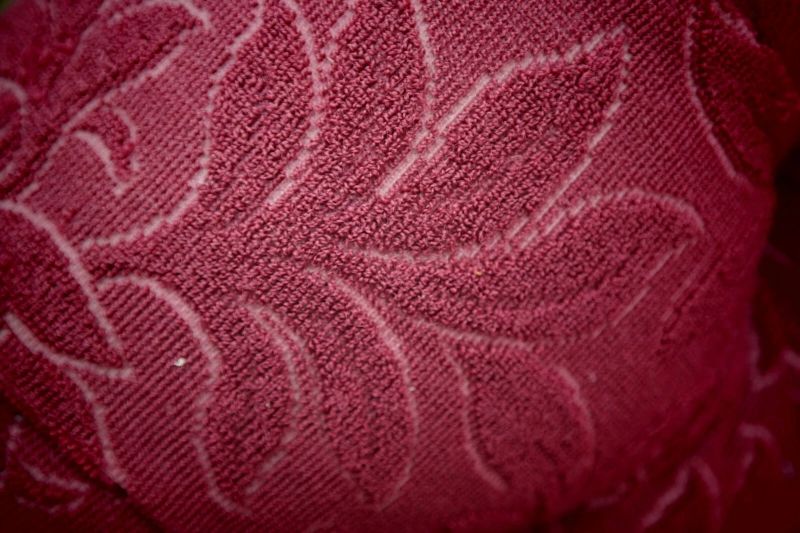 A Howard & Sons buttoned open armchair in Heavy Burgundy Fabric - Image 16