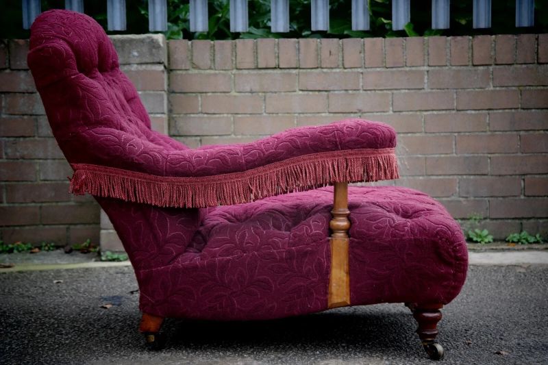 A Howard & Sons buttoned open armchair in Heavy Burgundy Fabric - Image 7