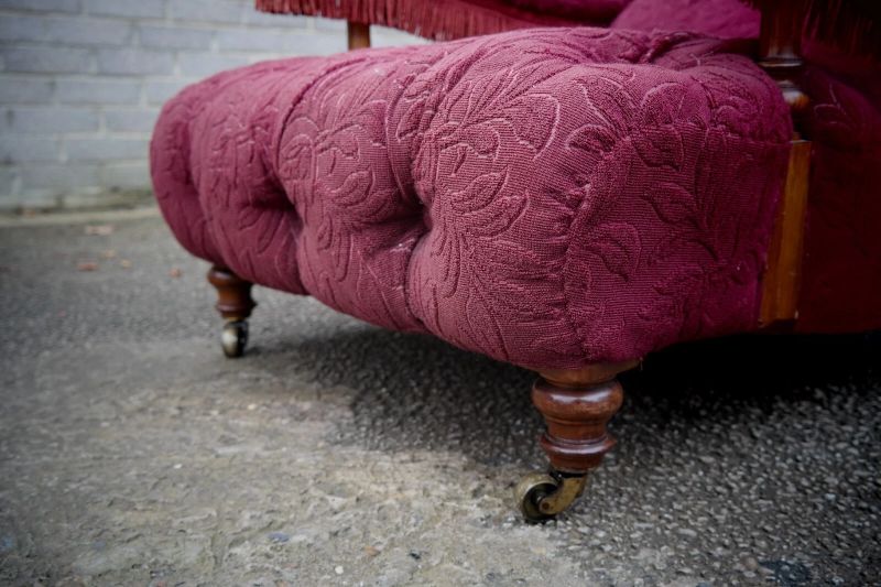A Howard & Sons buttoned open armchair in Heavy Burgundy Fabric - Image 19