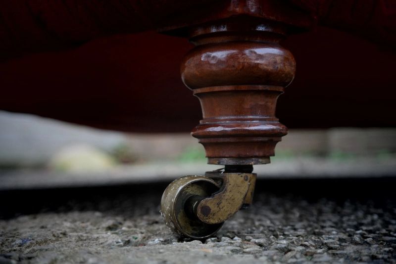 A Howard & Sons buttoned open armchair in Heavy Burgundy Fabric - Image 18